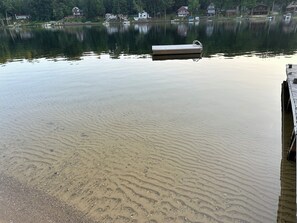 Weed free sandy swimming with floating swim raft.