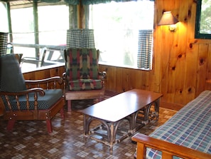 Interior living area with authentic amenities and original knotty pine