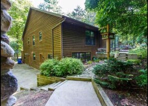Side entrance at ground level. The stairs are for a different outbuilding.