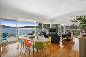 Open plan living, dining and kitchen area taking in the views