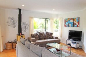 Living room and fire at 60 Waiheke