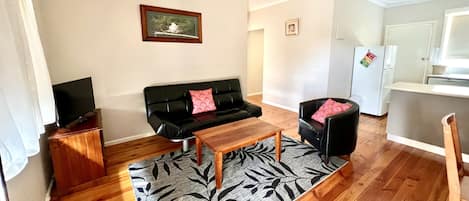 Lounge area with a view of the park and large window for natural light