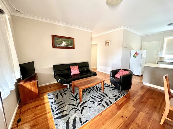 Lounge area with a view of the park and large window for natural light