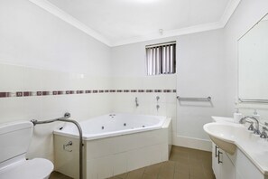 Spa Bathroom with rails in downstairs access apt