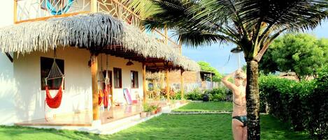 Take a fresh shower under our Palm Tree, keeping sand away from the house 