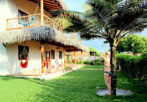 Take a fresh shower under our Palm Tree, keeping sand away from the house 