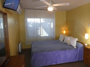 Main Bedroom pocket spring Queen, split system, TV,  dressing table, hair dryer.