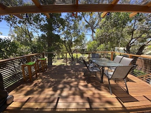 Big shady upstairs deck with bar seating and outdoor dining