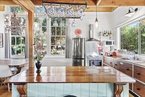 The kitchen includes a full size fridge and freezer