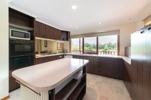Upstairs kitchen delight: Well-equipped for delightful cooking. Thoughtful and convenient. 