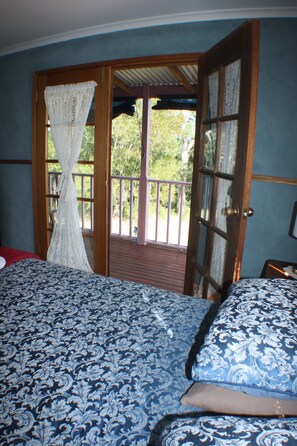 Queen bed with verandah access.