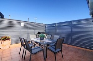 Private Outdoor Courtyard with BBQ and Table Setting