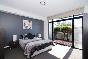 Queen bedroom Ground Floor opening up onto small private patio
