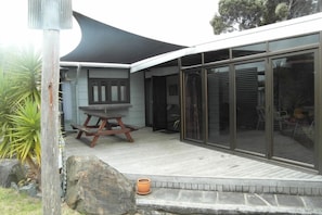 One of two outdoor decks with shade cloth
