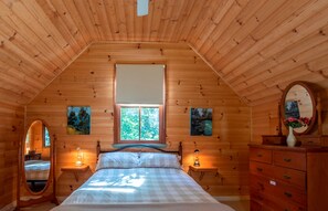 Attic bedroom with queen bed