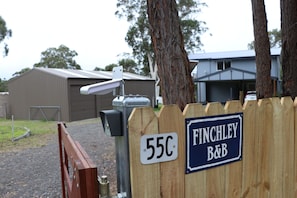 main electronic entry gate to Finchley - beside it is another metal farm gate