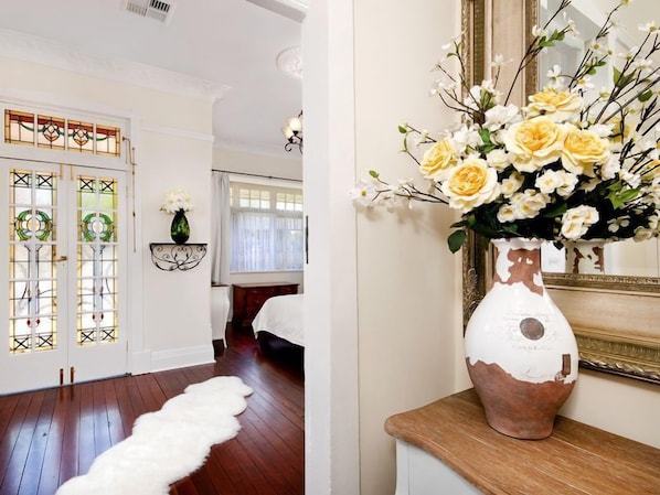 Hall table and large mirrors enhance the space entry foyer.