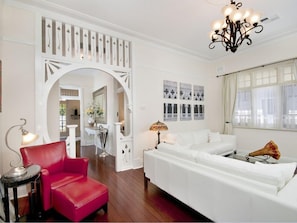 Original Fretwork frames a beautiful loungeroom.