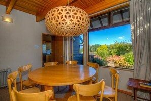 Dining area opening onto front deck