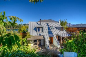 Lakefront Terrace - main house in garden setting by the lake