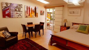 Spacious studio style apartment opens out to the pool area.