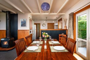 The dining table comfortably seats six and is part of the open plan living space
