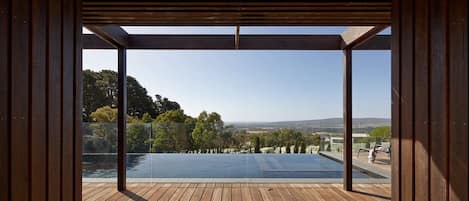 Bay views overlooking the infinity edge pool and vines