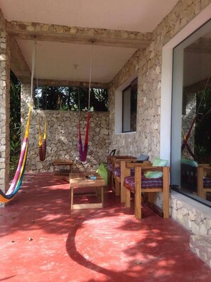 Outside terrace with hammocks and chairs