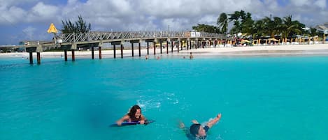 Swimming out to the trampoline at the Boatyard. The water is actually that blue!