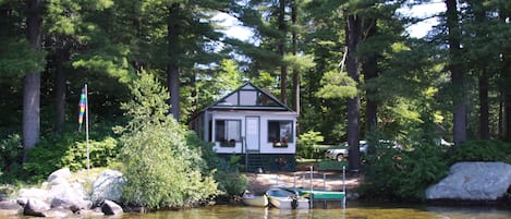Cottage & dock among ancient pines and stone wall. Dock has since been upgraded.