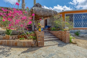 Entrance to the terrace adjacent to the house. Palapa roof & great views.