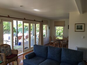 Dining area with larger corner of veranda which has an outdoor table and chairs 