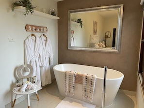 Large free standing bath, complimentary robes, bath salts, candles, flowers etc