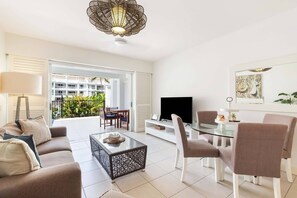 Enjoy streaming services on the TV and step onto the balcony from the open-plan living area.