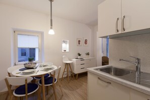 Dining area with fully equipped kitchen