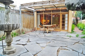 private courtyard, pergola and table