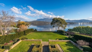 View from upstairs balcony across lawn the the Derwent River and Mt. Wellington.