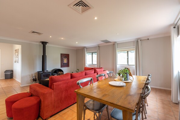 Hunter Gleann Cottage- The living/Dining space with fireplace and TV.