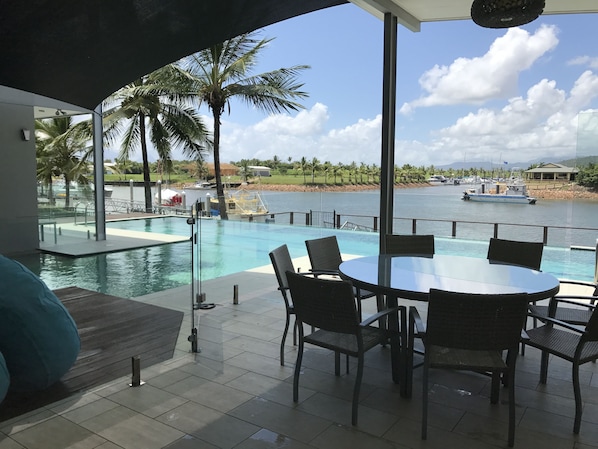 On the poolside deck overlooking Hinchinbrook Harbour