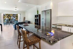The kitchen centres around an island bench where you can sit and converse with the cook.
