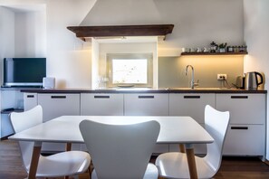 Dining for four people with fully equipped kitchen