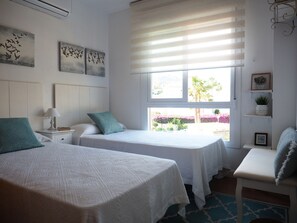 Second bedroom with two single beds.