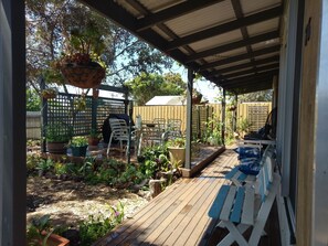 On the deck at front of house.