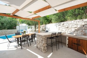 Outdoor dining table.  Outdoor sink, BBQ