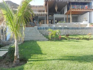 Watching the house with the ocean behind