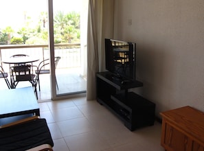 Tv and sitting room and balcony