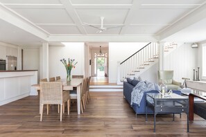 the open plan living/dining area with high ceiling