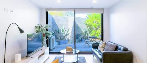 Spacious Living Room With Backyard View