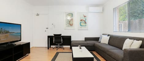 Lounge Room with study desk and Reverse cycle air-conditioner