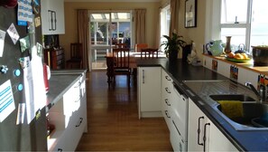 Kitchen, looking towards dining area and outdoor deck